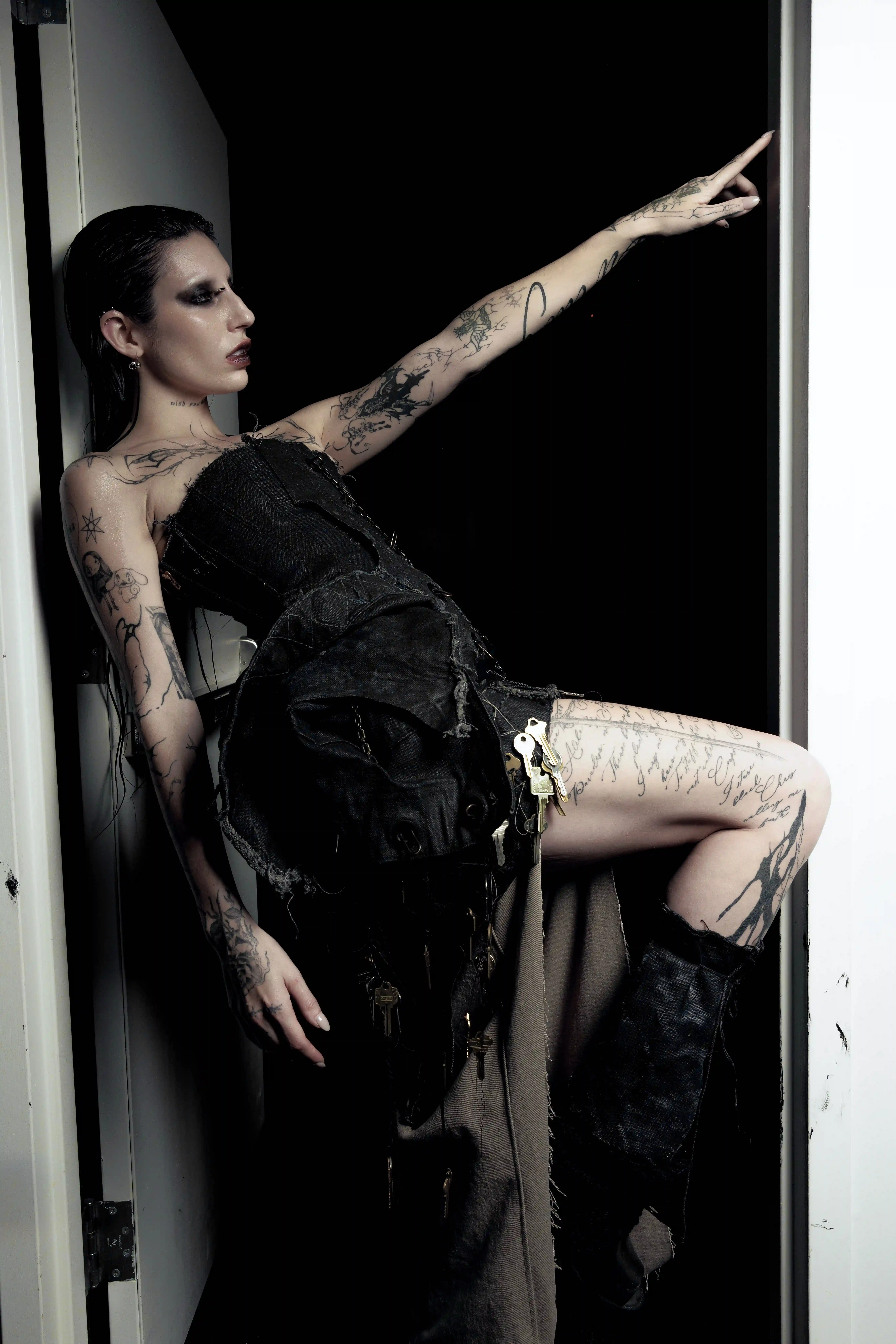 DeathByRomy in a pirate like otufit posing more close-up